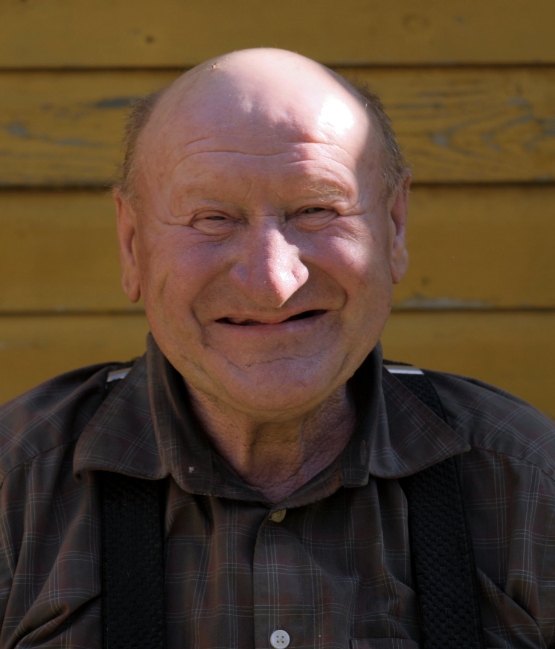 Senior man smiling before replacing missing teeth with dental implants in Chicago