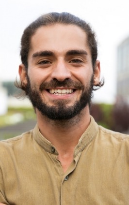 Smiling young man with beard