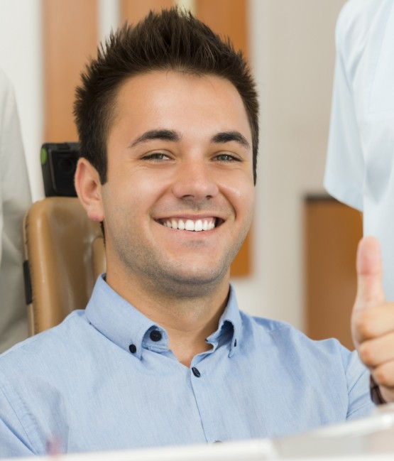 Man smiling in dental chair in Chicago dental office