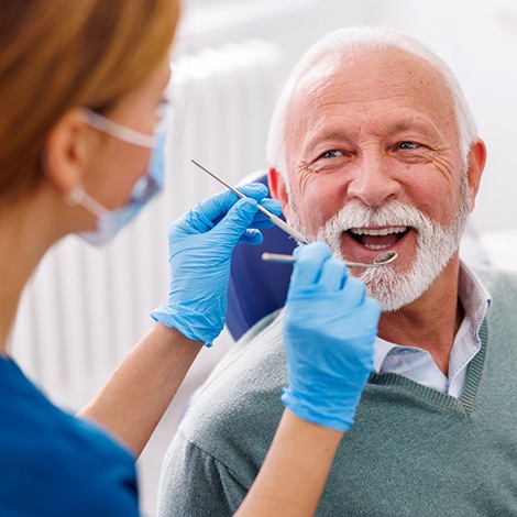 Man smiles at dentist?