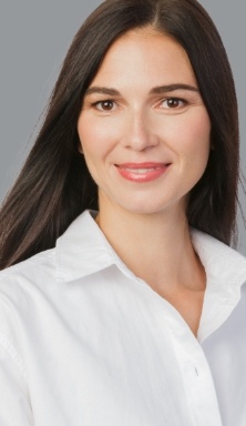 Smiling woman in white collared shirt