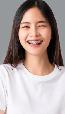 Young woman with braces smiling