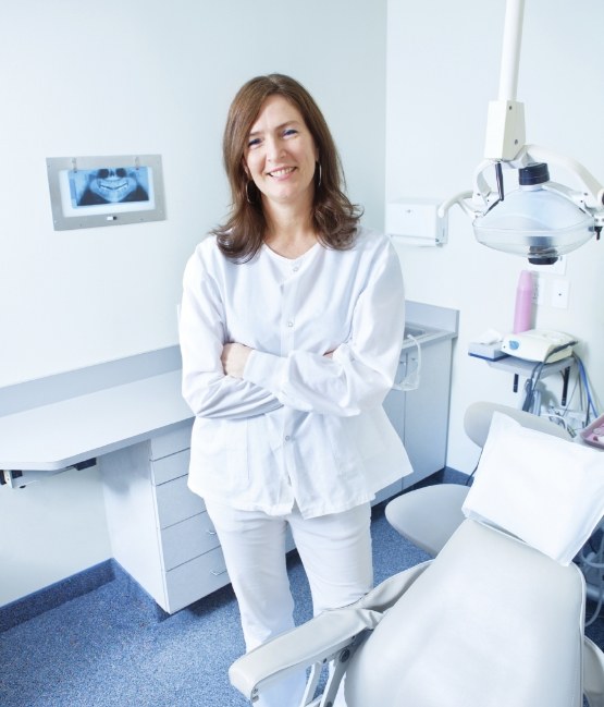 Smiling Chicago dental team member standing in dental treatment room