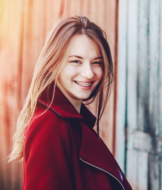 Young woman smiling with braces in Chicago