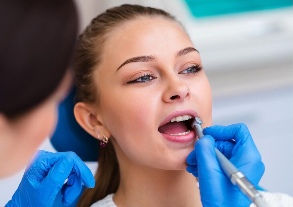 Close-up of a dental examination during a consultation to compare dental bonding and veneers options